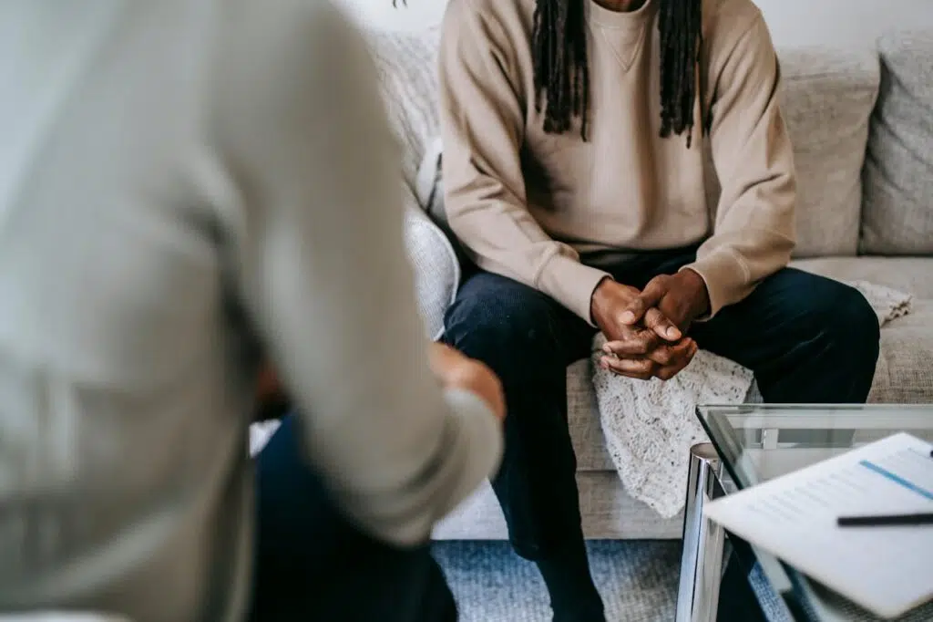 A serene conversation between two people in a therapy session for Trauma healing. Zip Codes: Austin area 78746, 78730, 78733, 78739, 78732, 78701, 78703. Round Rock area 78681, 78665, 78641, 78717, 78613.