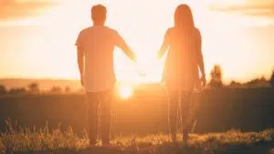A couple holding hands at sunset, symbolizing relationship healing and renewed connection. Zip Codes: Austin area 78746, 78730, 78733, 78739, 78732, 78701, 78703. Round Rock area 78681, 78665, 78641, 78717, 78613.